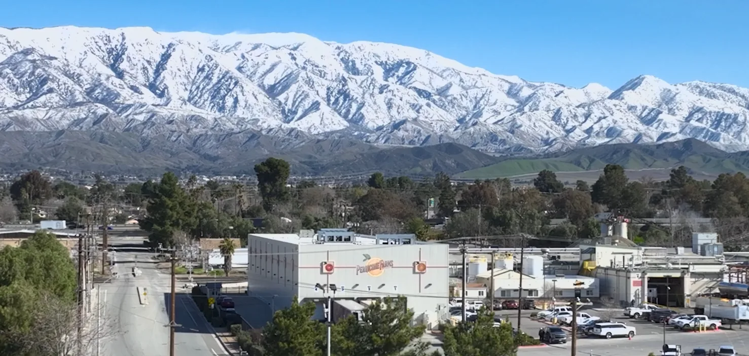 Snow-covered San Bernardino Mountains rising above downtown Beaumont, CA