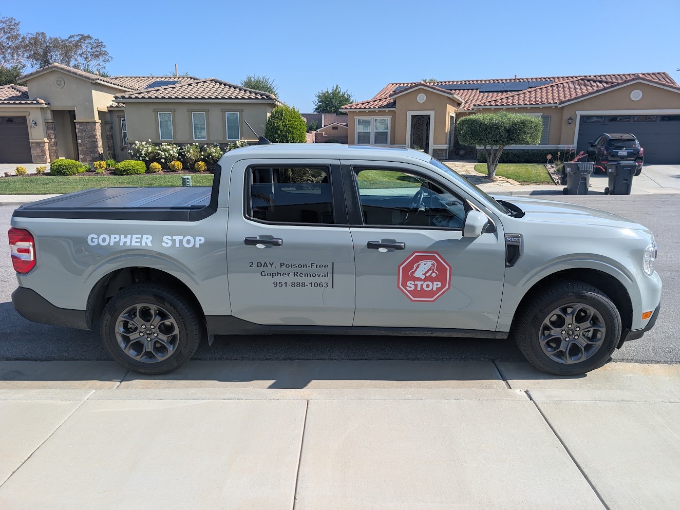 The Gopher Stop truck parked in a residential neighborhood ready for service