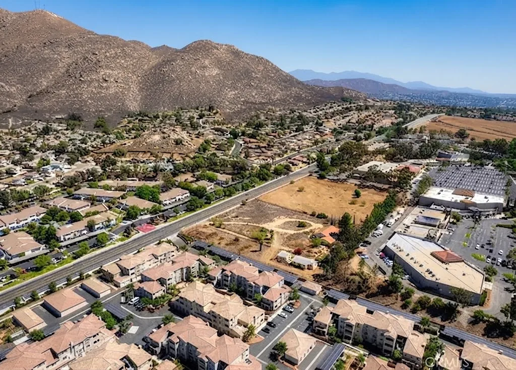 Aerial view of Riverside, California homes backing up to the open hillside near Sycamore Canyon Park where gophers move in from open space