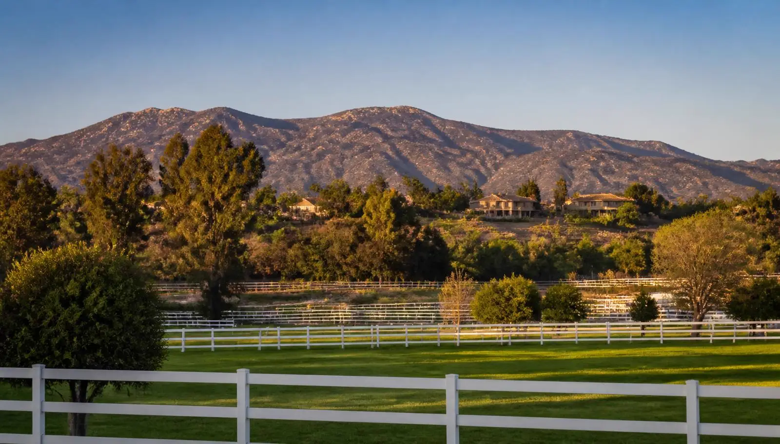 Wildomar neighborhoods and large residential lots beneath brush-covered hills