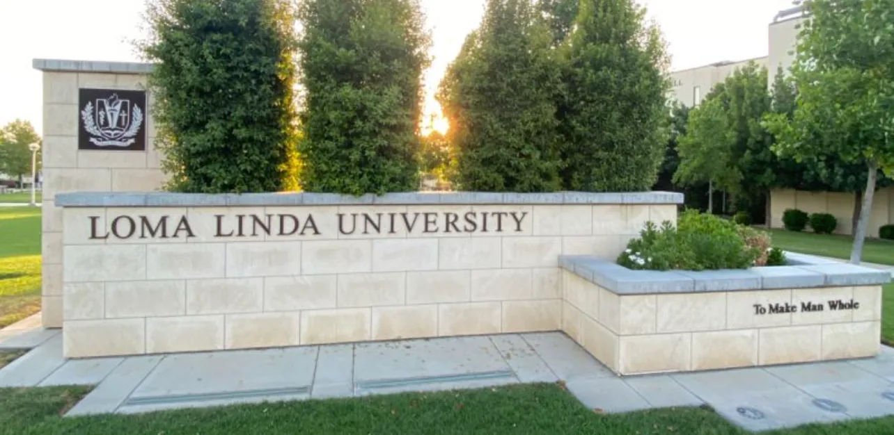 Loma Linda University entrance sign on Anderson Street, a stone monument marking the city's medical-center district